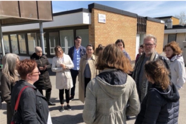 A group from the community on a walk with city staff